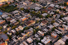 Aerial shot of a bustling Guntur neighborhood with various properties.