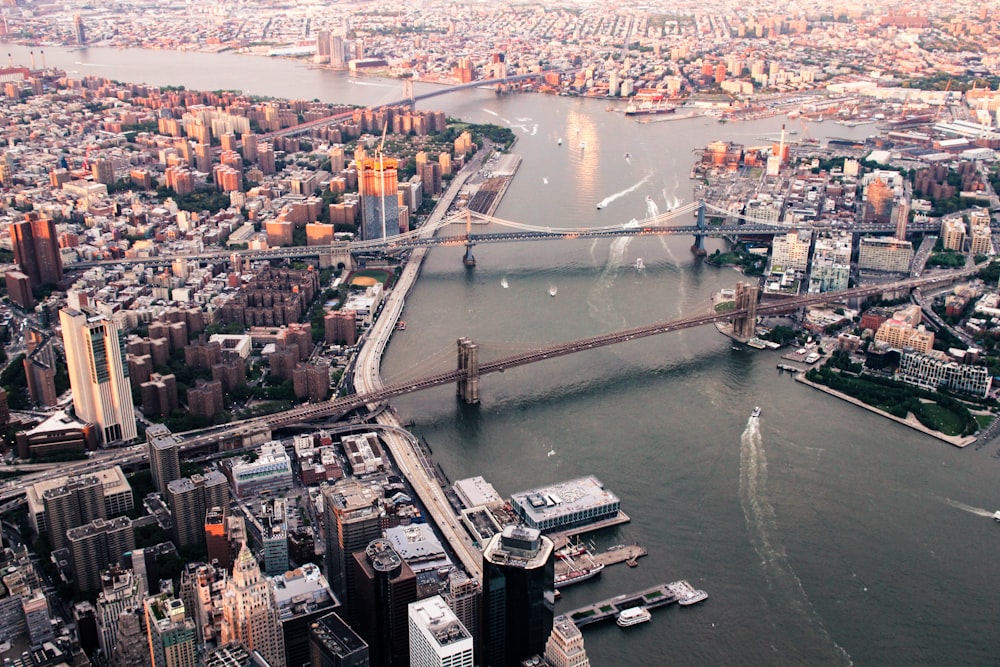 body of water between island with building and bridge at daytime