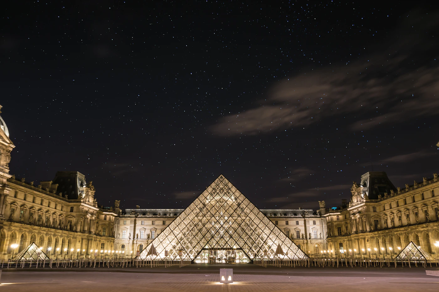 The Louvre pyramid in Paris at night