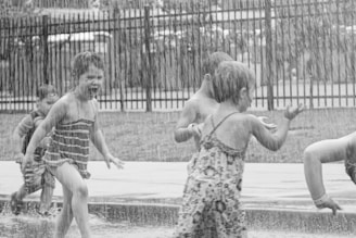 Children playing joyfully in a church garden.