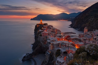 aerial view of village on mountain cliff during orange sunset