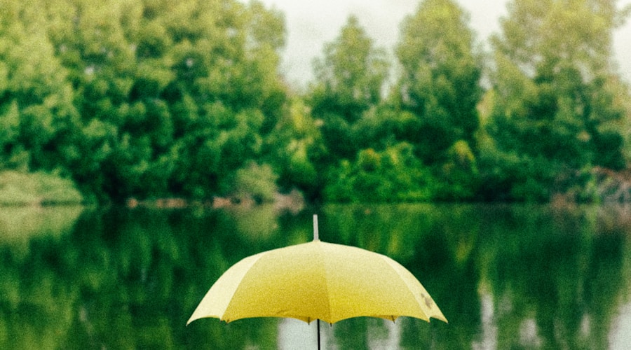yellow umbrella on surface of water at daytime