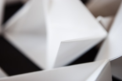 Sharp, angular forms in dark tones highlighting modern 3D aesthetics.