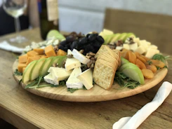 Close-up of a luxury cheese platter featuring a variety of aged cheeses and gourmet crackers.