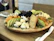A stylish close-up of a gourmet snack platter with elegant lighting highlighting textures and colors.