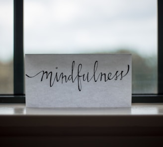 mindfulness printed paper near window