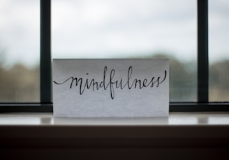 mindfulness printed paper near window