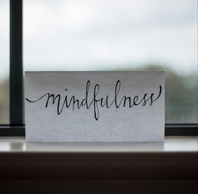 mindfulness printed paper near window