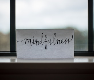 mindfulness printed paper near window