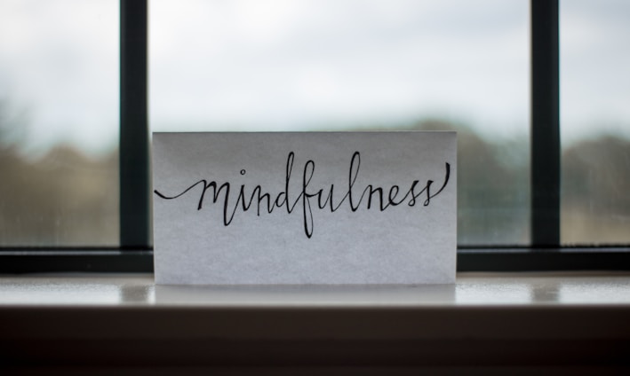 mindfulness printed paper near window