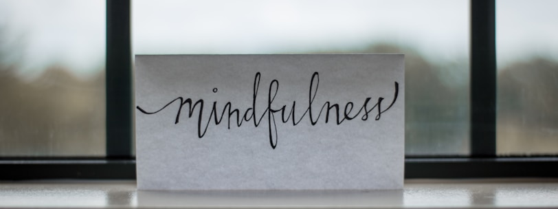 mindfulness printed paper near window