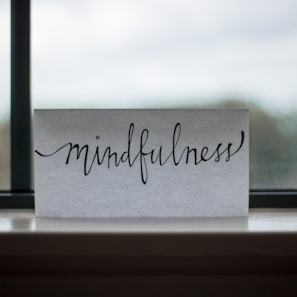 mindfulness printed paper near window