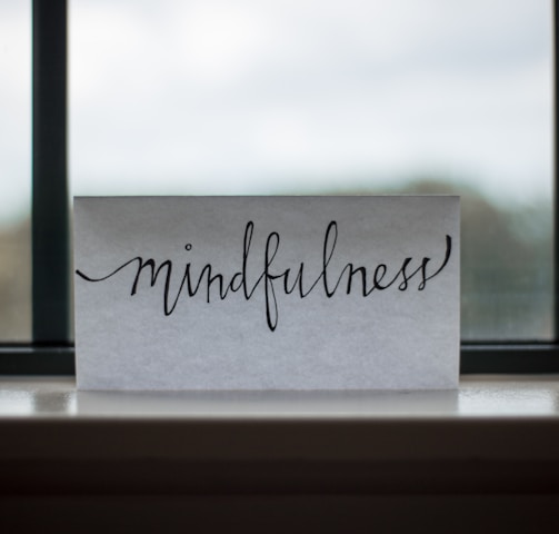 mindfulness printed paper near window