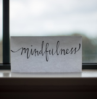 mindfulness printed paper near window