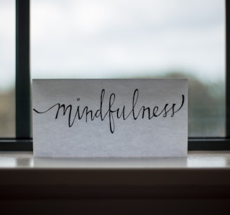 mindfulness printed paper near window