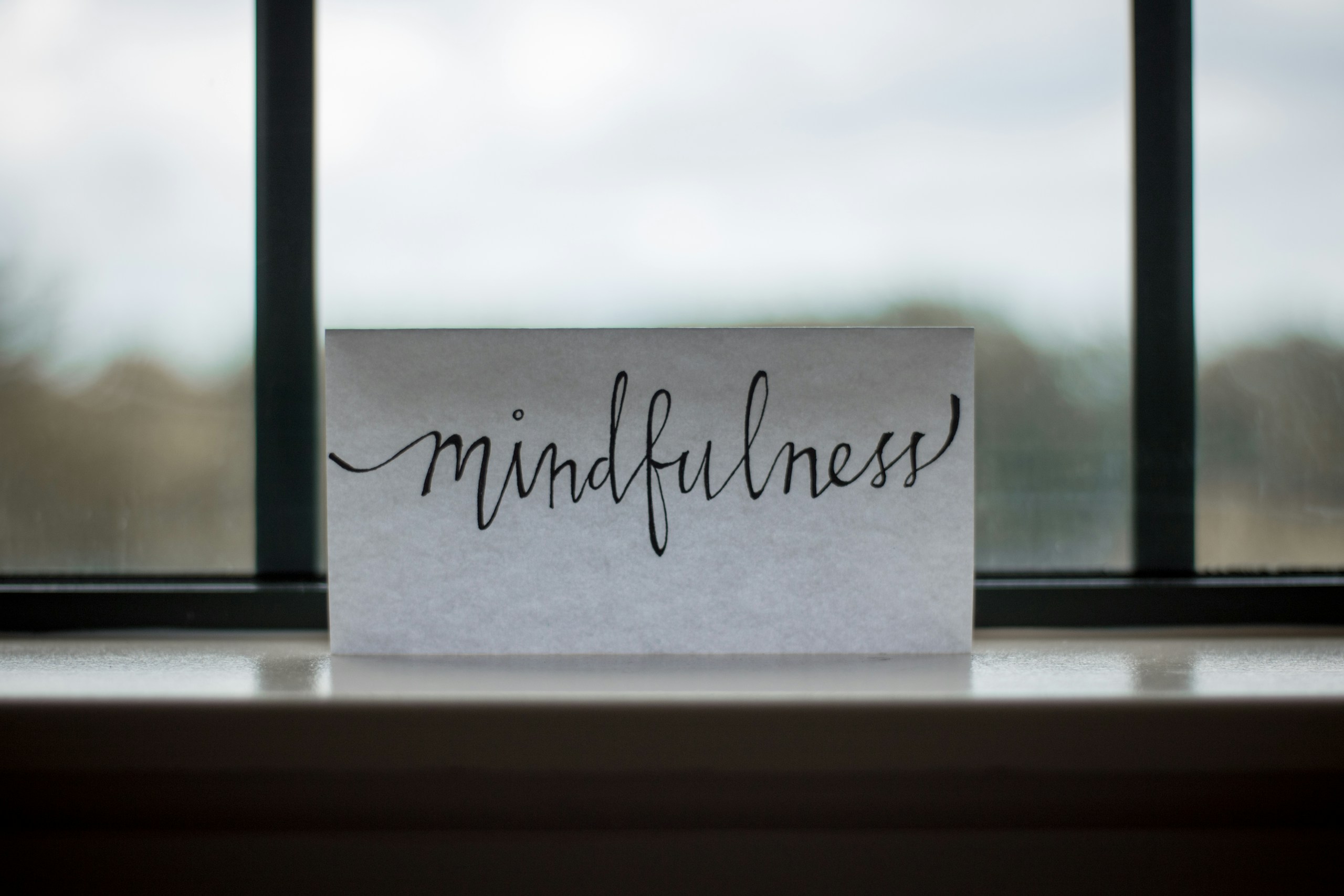 mindfulness at work printed paper near window