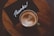flat lay photography of coffee latte in teacup on table