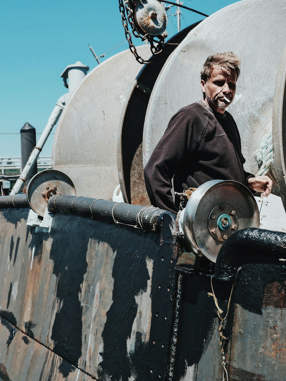 man standing on ship at daytime