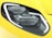 A close-up of a car headlight featuring a sleek and modern design with LED light strips and a glossy surface. The headlight is set against a bright yellow car body with reflective highlights.