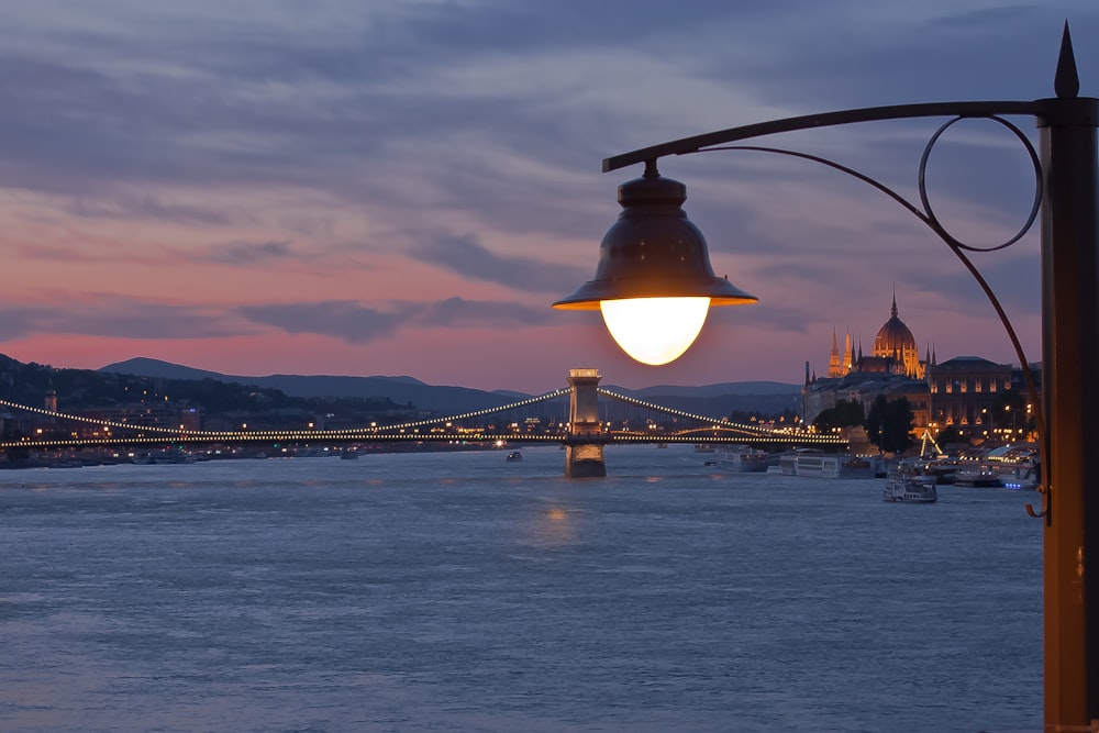 post lamp in front of bridge