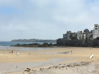 Families enjoying clean, well-equipped beach with sports facilities