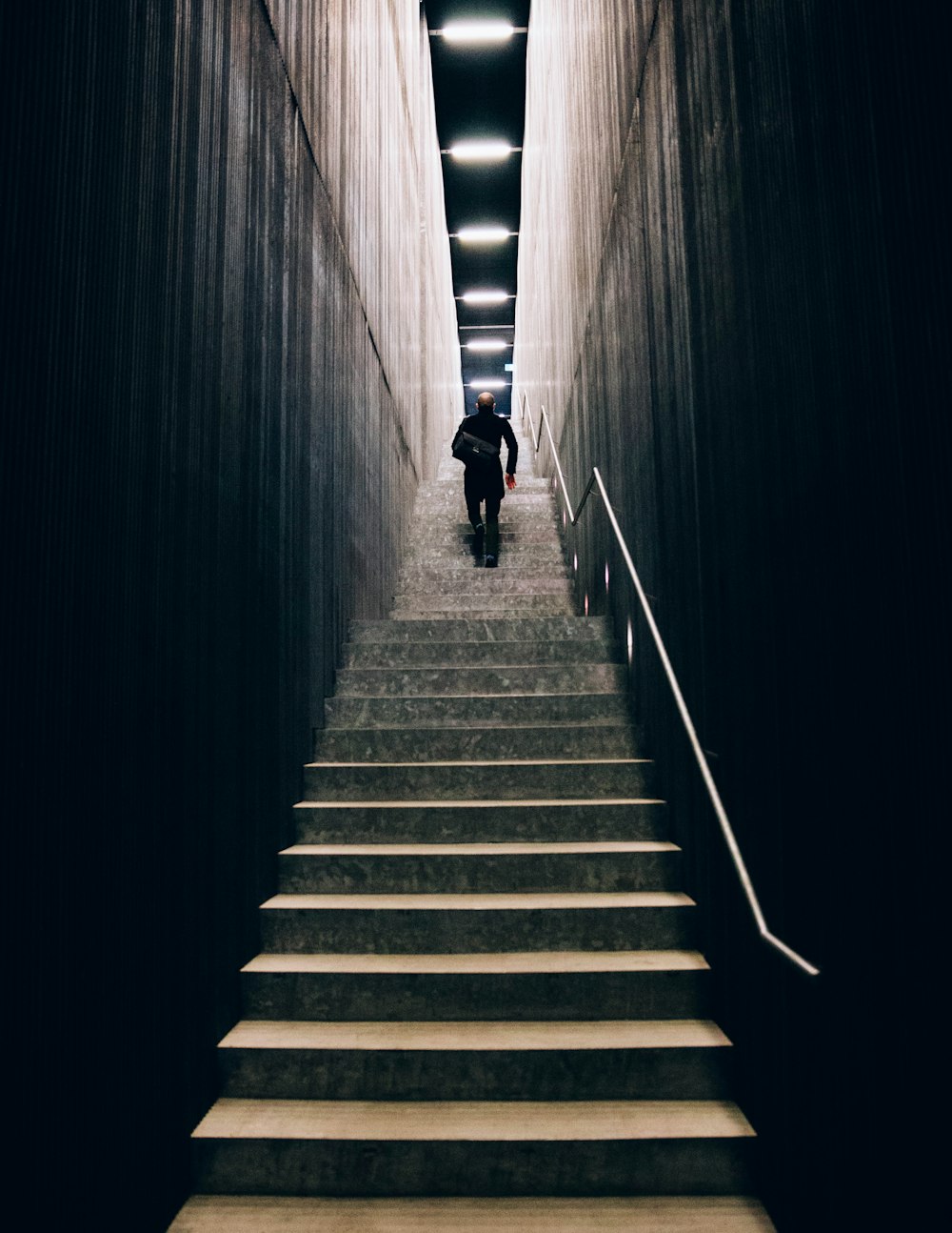 Man In Black Pants Going Down Stairs Photo Free Melbourne Image On Unsplash