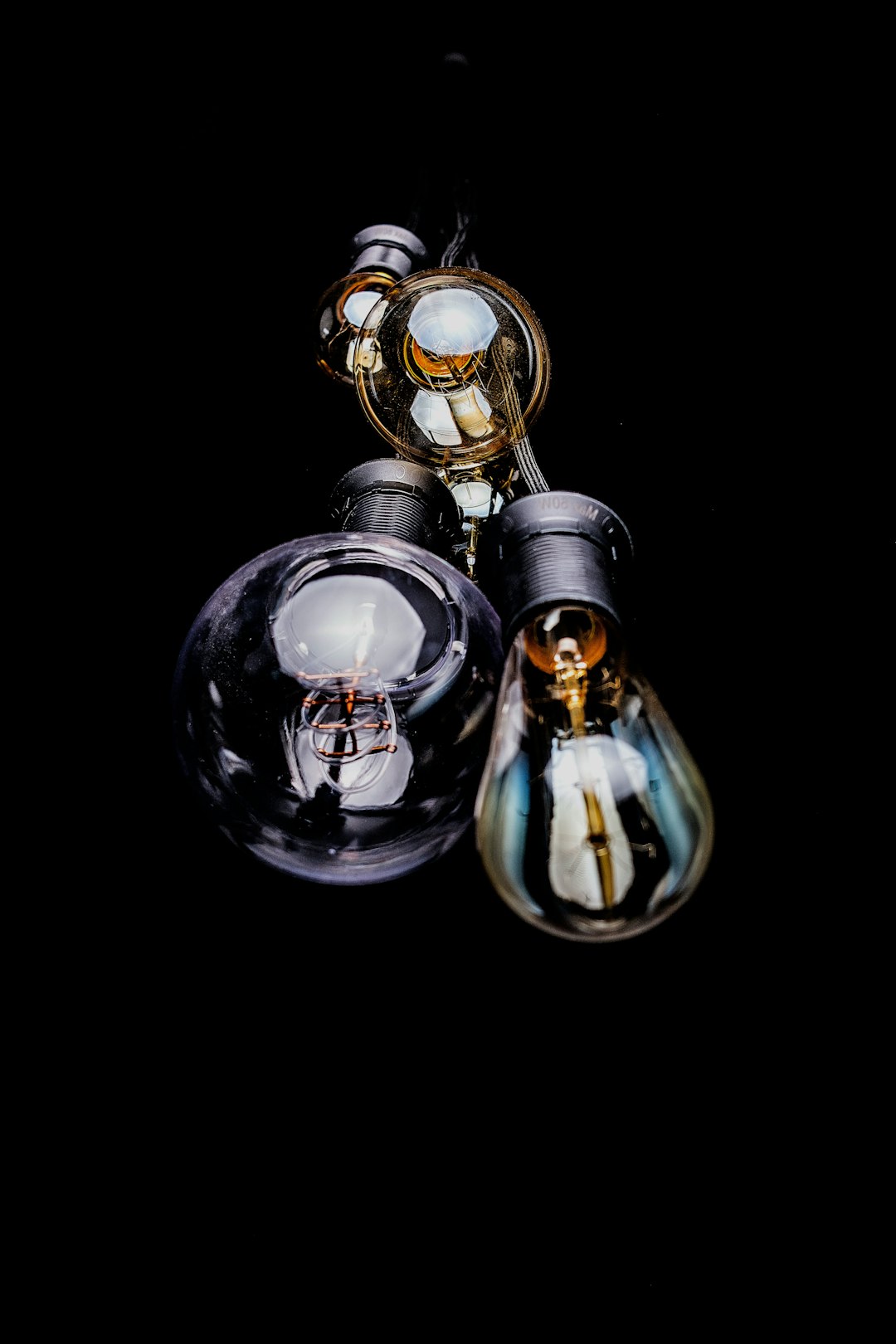 A close-up of the light bulbs against the black background in Cascais.
