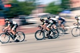 time lapse photography of bikers