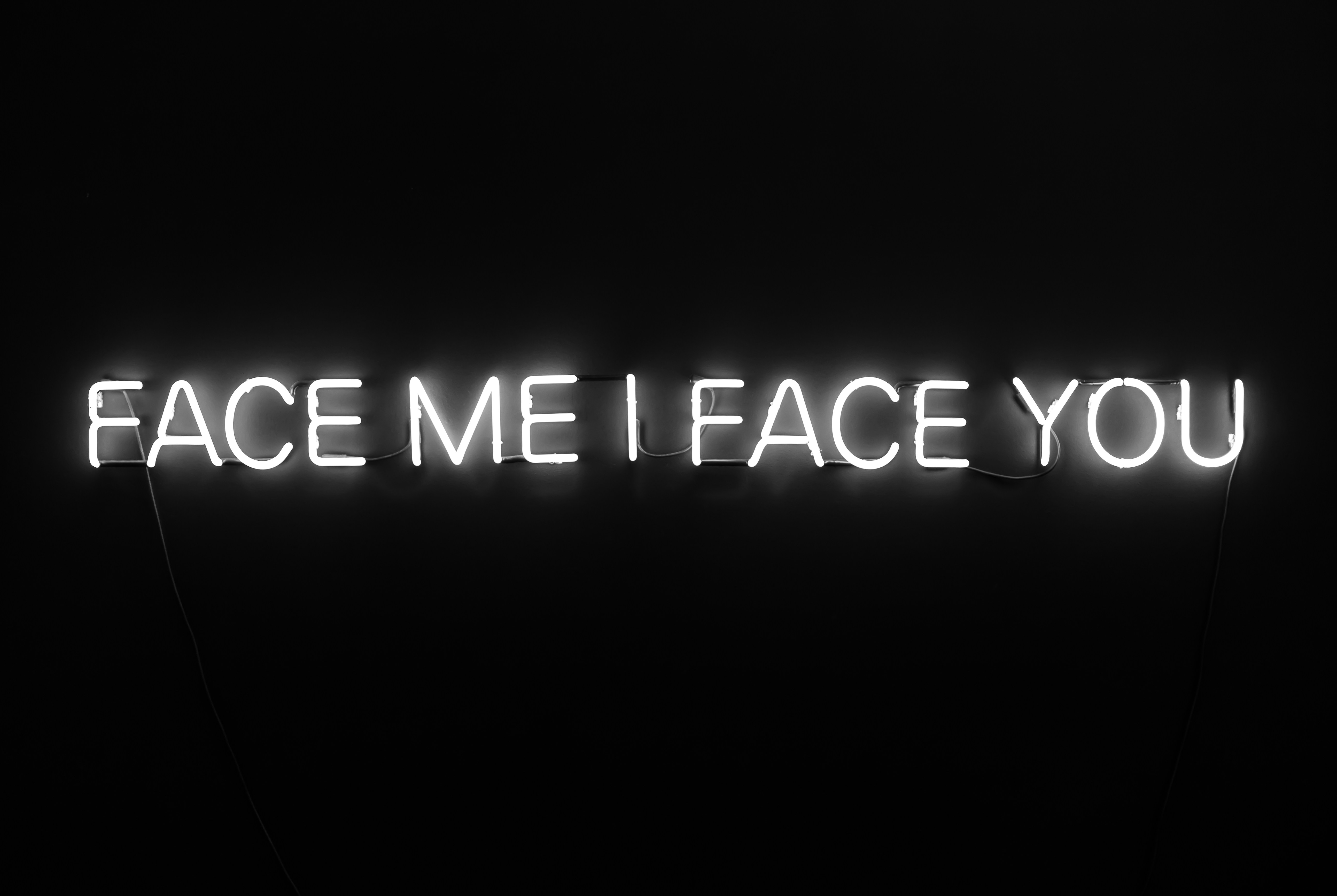 Neon sign in black room