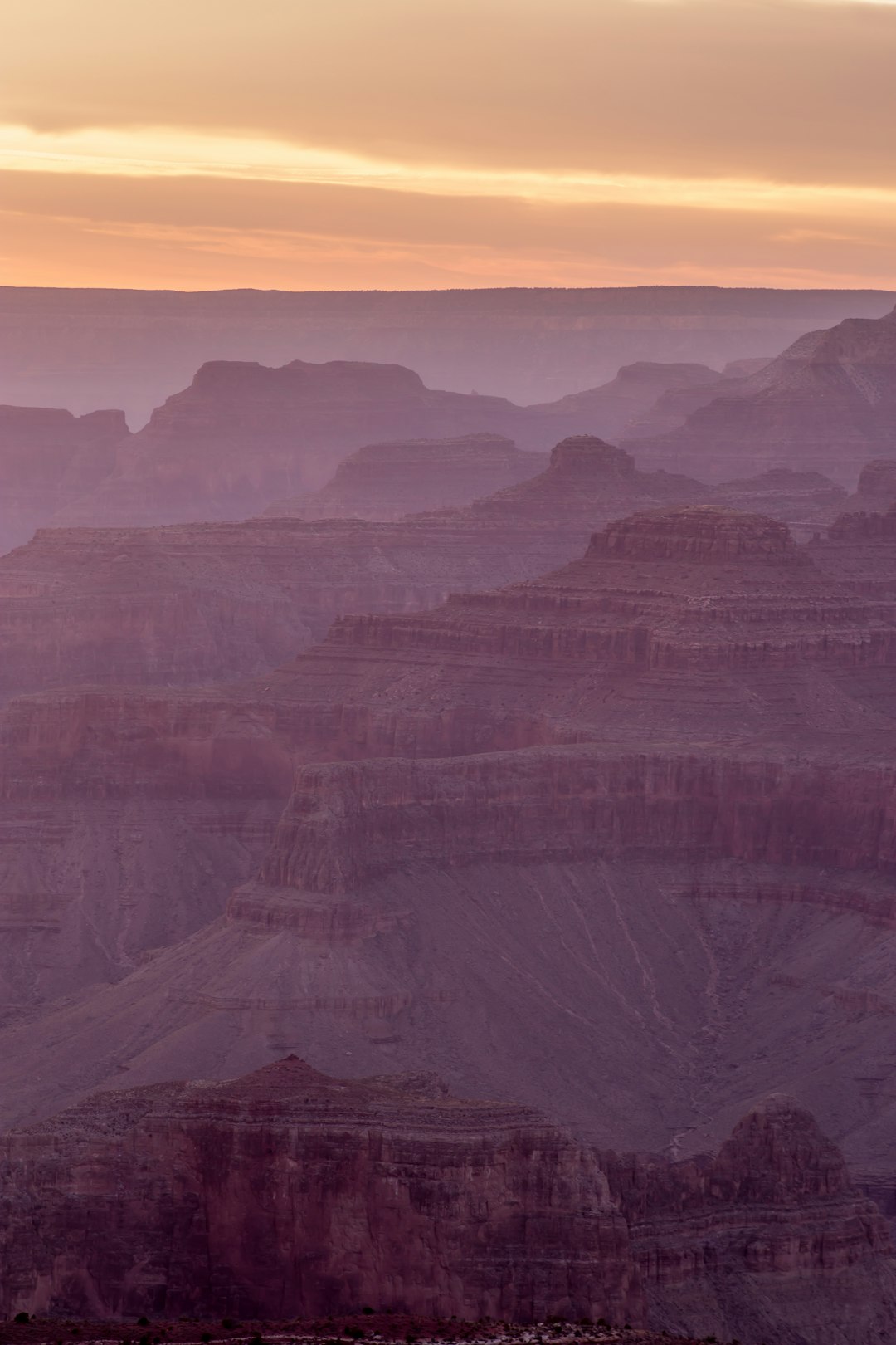 brown mountains under sunset