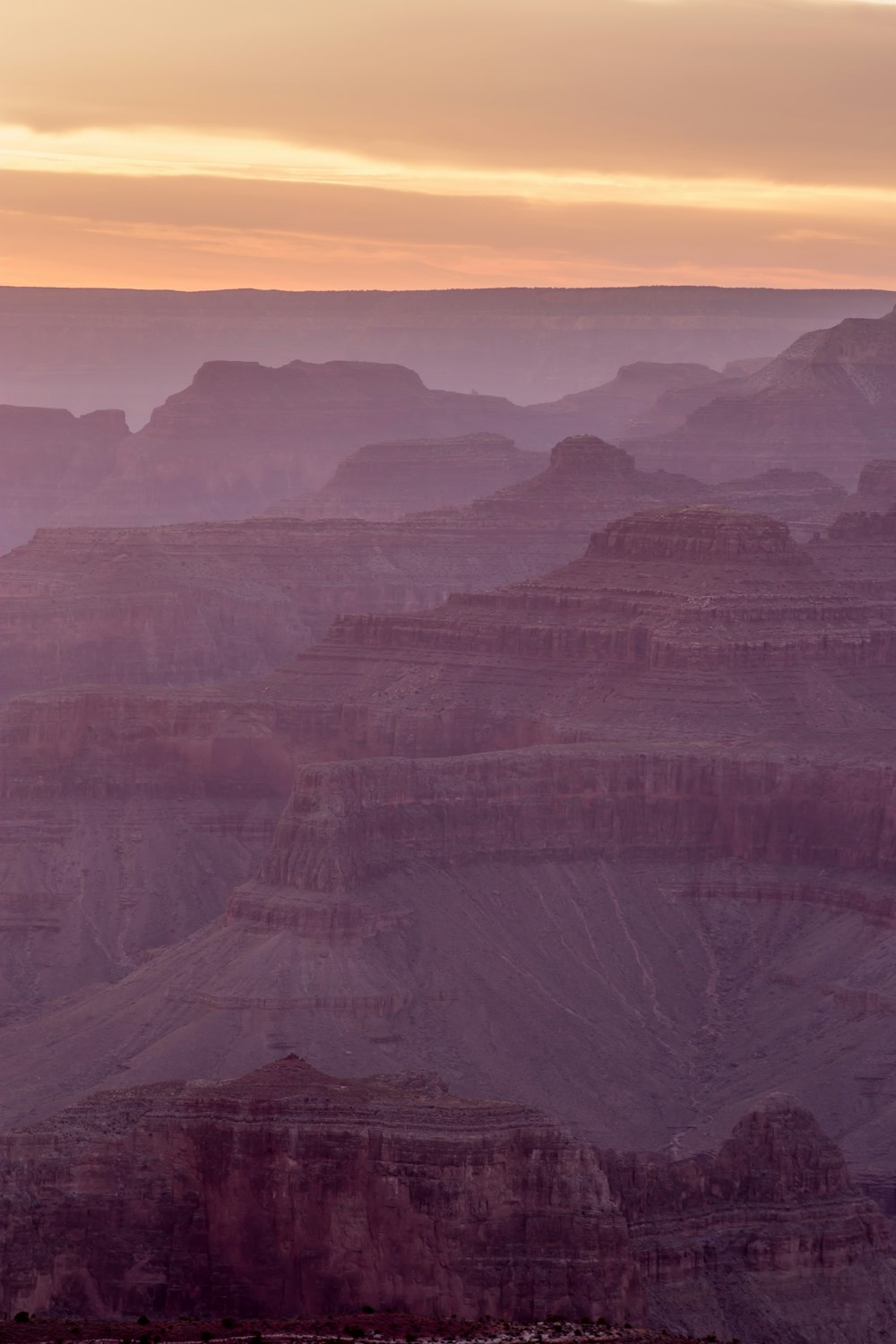 brown mountains under sunset