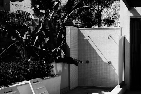 A portable shower facility with privacy curtains in a scenic outdoor location.