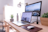MacBook Pro on table beside white iMac and Magic Mouse