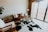 Cozy living room featuring a cowhide rug under a coffee table.