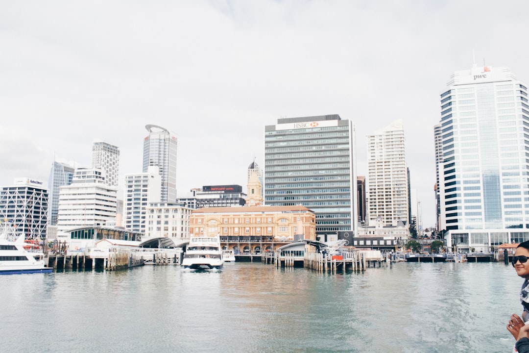 white ship on body of water in front of building, Urban waterfront
