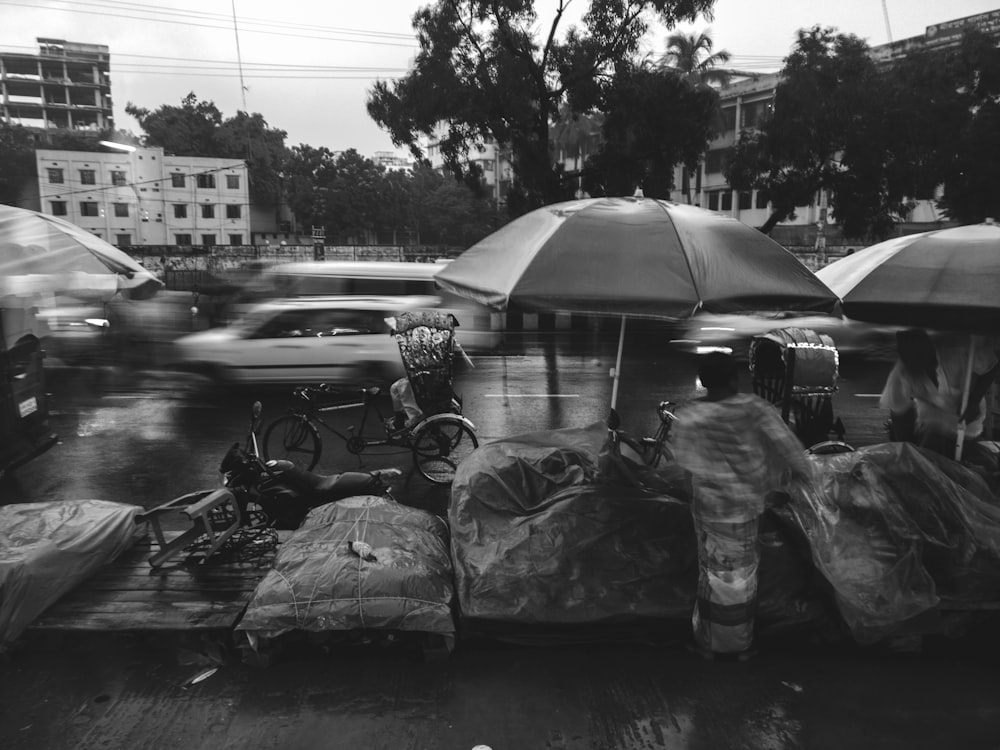 grayscale photo of bicycle beside cars