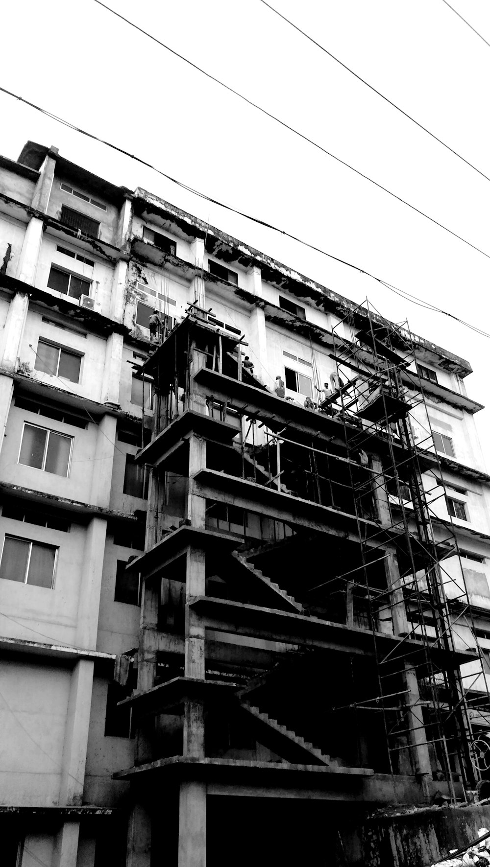 grayscale photo of a building under construction