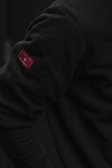 A close-up of a tech shirt with NFC tag.