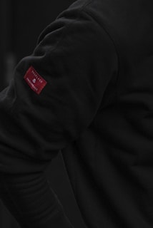 Close-up of a GLP-1 patch on a person's arm with clear branding visible