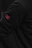 Close-up of a minimalist t-shirt with an embedded NFC chip glowing softly.