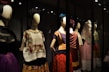 A stylish mannequin dressed in a vibrant ethnic outfit with intricate embroidery.