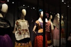 A stylish mannequin dressed in a vibrant ethnic outfit with intricate embroidery.