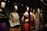 A collection of mannequins adorned with traditional, colorful dresses, featuring elaborate patterns and textiles. Each mannequin has a distinctive hairstyle and pose, creating a sense of cultural heritage and artistic expression.