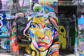 Portrait of Diana Patricia Osorio González performing an expressive live art piece in an outdoor urban setting.