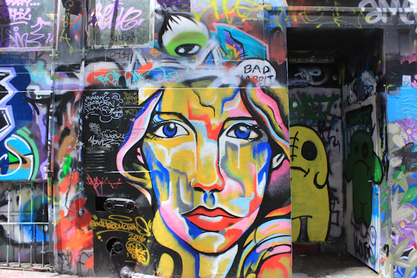 Portrait of Diana Patricia Osorio González performing an expressive live art piece in an outdoor urban setting.