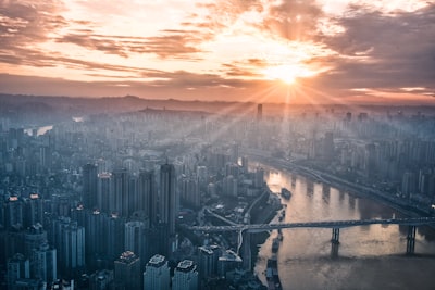 gray concrete buildings during golden hour radiant teams background