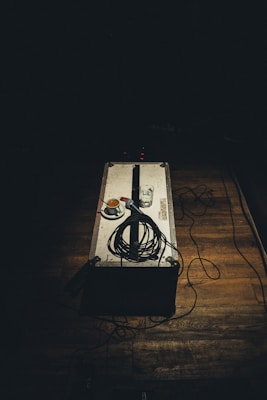 closeup photo of microphone on gray box