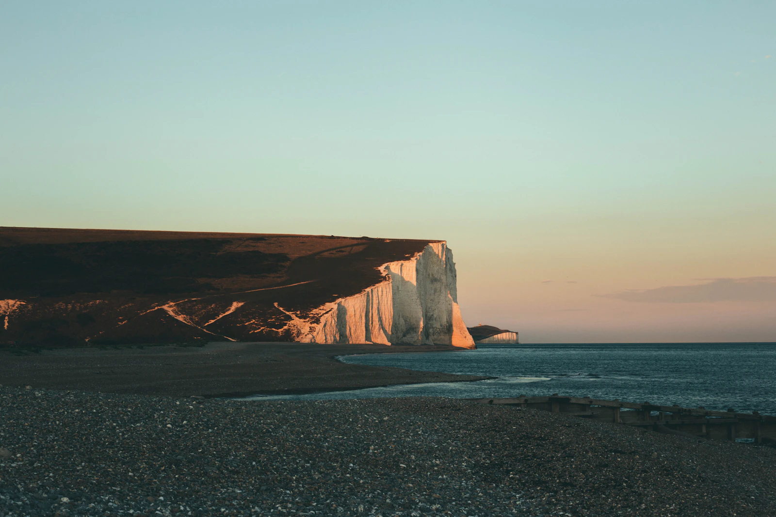 The white chalk cliffs of the Seven Sisters along the East Sussex coast.