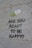 A large painted capsule labeled 'PROZAC 20 mg' is depicted on a textured wall. Below the capsule, the text 'ARE YOU READY TO BE HAPPY?' is spray-painted in black. Beneath this question, the word 'NO!' is also written in black.