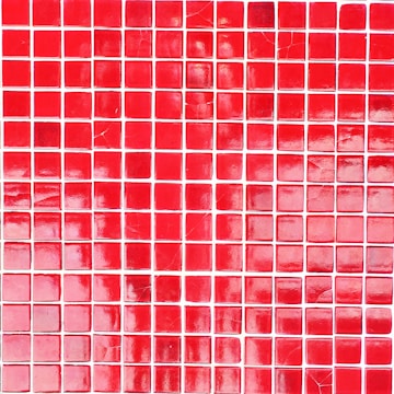 A grid of square tiles in various shades of red with some tiles exhibiting a glossy finish and light reflections. The arrangement of the tiles is somewhat irregular with a noticeable pattern disruption in some areas.